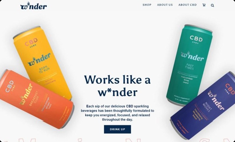 W*nder homepage hero with four brightly colored CBD cans floating around the headline Works like a w*nder and a Drink Up button.